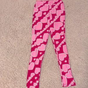 I am selling this red, pink, and white, lularoe valentines leggings for 13-14